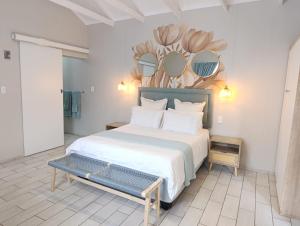 a bedroom with a large bed with mirrors on the wall at Joy Haven - Cottage in Centurion +18 photos