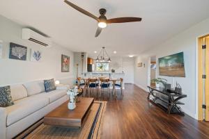 a living room with a couch and a ceiling fan at Kaanapali Plantation 34 · KPL 34 2BD Pool & Resort's Amenities, in Kahana