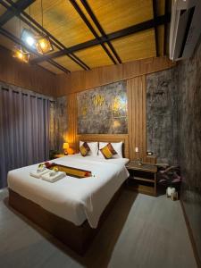 Postel nebo postele na pokoji v ubytování Baan Rattana