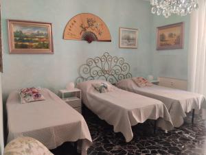 En eller flere senge i et værelse på Amarcorde Home in Corso Buenos Aires con 6 posti letto