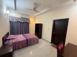 Postel nebo postele na pokoji v ubytování Executive Lodges