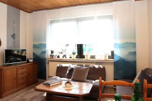 Μια τηλεόραση ή/και κέντρο ψυχαγωγίας στο Ferienwohnung Hartmann Medebach