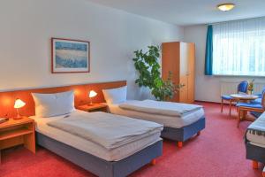 מיטה או מיטות בחדר ב-Zum Alten Schweden