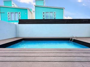 a swimming pool on the side of a building at Grandioso Okinawa Villa Kin 2 - Vacation STAY 90150v in Yaka