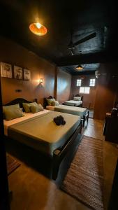 a bedroom with two beds in a room at Arana Weligama in Weligama +12 photos