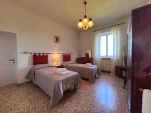 Postel nebo postele na pokoji v ubytování MariSanti House