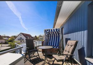 En balkon eller terrasse på Schatzkiste mit Meerblick + 6 billeder