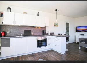 Køkken eller tekøkken på Schatzkiste mit Meerblick