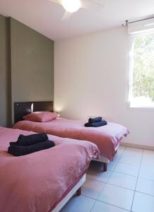 Postel nebo postele na pokoji v ubytování Le Chant des Cigales