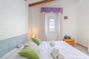 Postel nebo postele na pokoji v ubytování Casa Vacanza Cristina + 25 fotografií