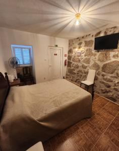 TV a/nebo společenská místnost v ubytování Casa da Aldeia 2 Belmonte