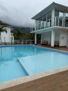 Πισίνα στο ή κοντά στο Conforto Maresias