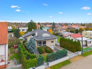 an aerial view of a house in a residential neighborhood at Black Dragon Haven Luxury Villa with Pool, Sauna & Jacuzzi in Prague