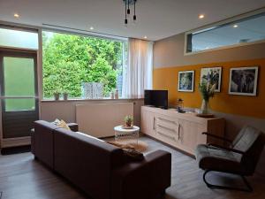 Μια τηλεόραση ή/και κέντρο ψυχαγωγίας στο 4 persoons appartement - ook te boeken voor 6 personen!