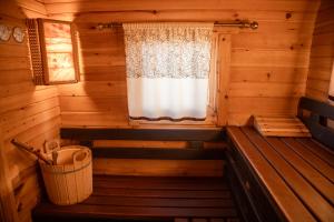 an interior of a wooden cabin with a window at All Seasons Sevan in Sevan