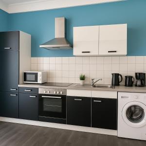 Η κουζίνα ή μικρή κουζίνα στο SUNNYHOME Monteurwohnungen und Apartments in Weiden