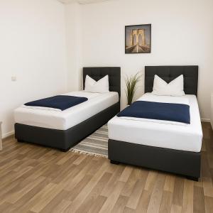 Ένα ή περισσότερα κρεβάτια σε δωμάτιο στο SUNNYHOME Monteurwohnungen und Apartments in Weiden