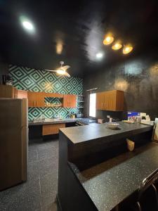 a kitchen with a large island in a room at Beach Trendy Lux Villa in Chicxulub