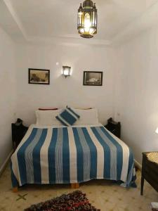 Ένα ή περισσότερα κρεβάτια σε δωμάτιο στο Riad spa Villa Marrakech