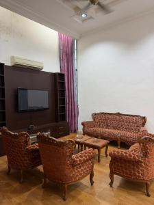 Μια τηλεόραση ή/και κέντρο ψυχαγωγίας στο Yasme Roomstay Kangar