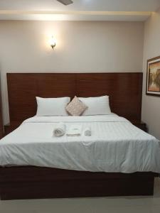 Voodi või voodid majutusasutuse Serene Stay - 7 BHK Villa toas