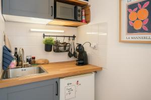 Η κουζίνα ή μικρή κουζίνα στο Studio lumineux et élégant au cœur de Lille