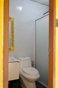 a bathroom with a white toilet and a mirror at จักรพันธ์วอลเลย์ in Ban Bang Toei (1) +13 photos