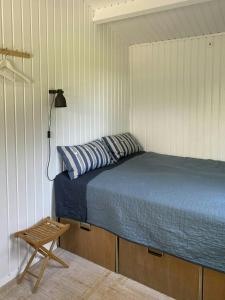 Ένα ή περισσότερα κρεβάτια σε δωμάτιο στο Holiday Home By Avnø Fjord In Front Of The Sea