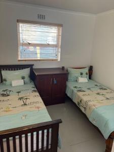 Giường trong phòng chung tại 2 Elwyn Road