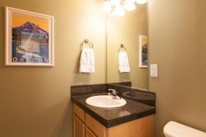 a bathroom with a sink and a mirror at Private Reserve 30 day minimum in Hood River +15 photos