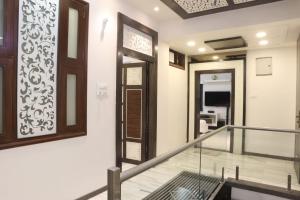 a room with a staircase with a door and a mirror at House of Raghuvansh in Jodhpur +15 photos