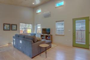 a living room with a couch and a table at Mod Pod in Bend +14 photos