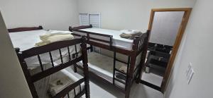 En eller flere senge i et værelse på Casa Completa com 2 Quartos Conforto e Espaço + 21 billeder