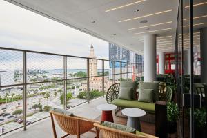 a balcony with a view of the city at citizenM Miami Worldcenter in Miami +59 photos