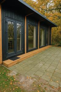 a screened in porch of a house with windows at Chalet Marter in Sellingen