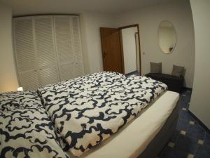 Ένα ή περισσότερα κρεβάτια σε δωμάτιο στο Am Waldrand