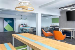 a meeting room with a table and chairs at Spark by Hilton Clarion in Clarion