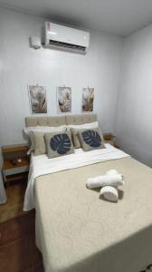 Postel nebo postele na pokoji v ubytování Quarto 1 próximo ao Aeroporto Internacional + 12 fotografií