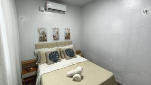 Postel nebo postele na pokoji v ubytování Quarto 1 próximo ao Aeroporto Internacional