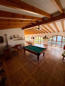 a large room with a pool table in it at Finca roxana in Elda