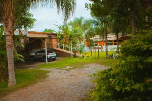 a car parked in front of a house at Cabañas Quinta Las Ruedas in San Isidro