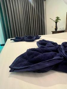 Postel nebo postele na pokoji v ubytování Jungle Nook Hiriketiya