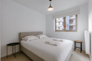 Ένα ή περισσότερα κρεβάτια σε δωμάτιο στο Stylish Family-Friendly Ostend Retreat, Close to Harbor and Free Parking