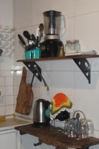 Kuchyň nebo kuchyňský kout v ubytování Suíte Oriente Vale do Capão