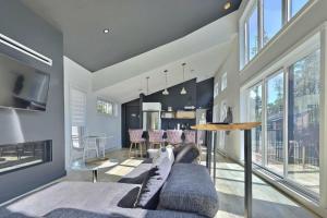 a living room with a couch and a table at Chalet Arianna in Pont-Rouge