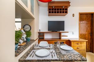 Et tv og/eller underholdning på Apartamento inteiro de 1 quarto no Edifício Royal Light