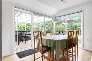 a dining room with a table and chairs at LF16121-Farso-Bjarkesvej-11 in Farsø