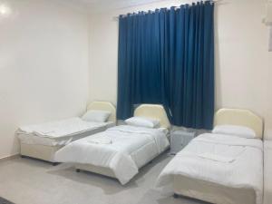 Postel nebo postele na pokoji v ubytování إطلالة غروب الشمس