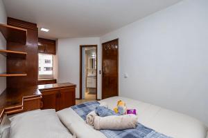 En eller flere senge i et værelse på Apartamento inteiro de 1 quarto no Edifício Royal Light