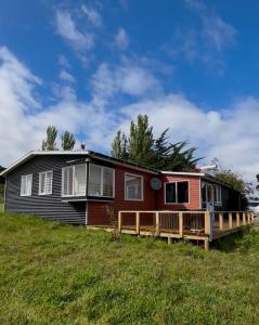 a house on a hill with a deck at Casadelaisla-Rilan in Rilán